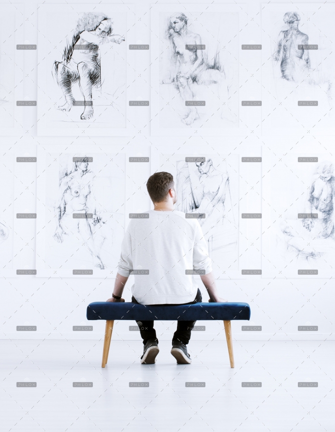 demo-attachment-218-man-relaxing-in-art-gallery-P9C4CGY-1